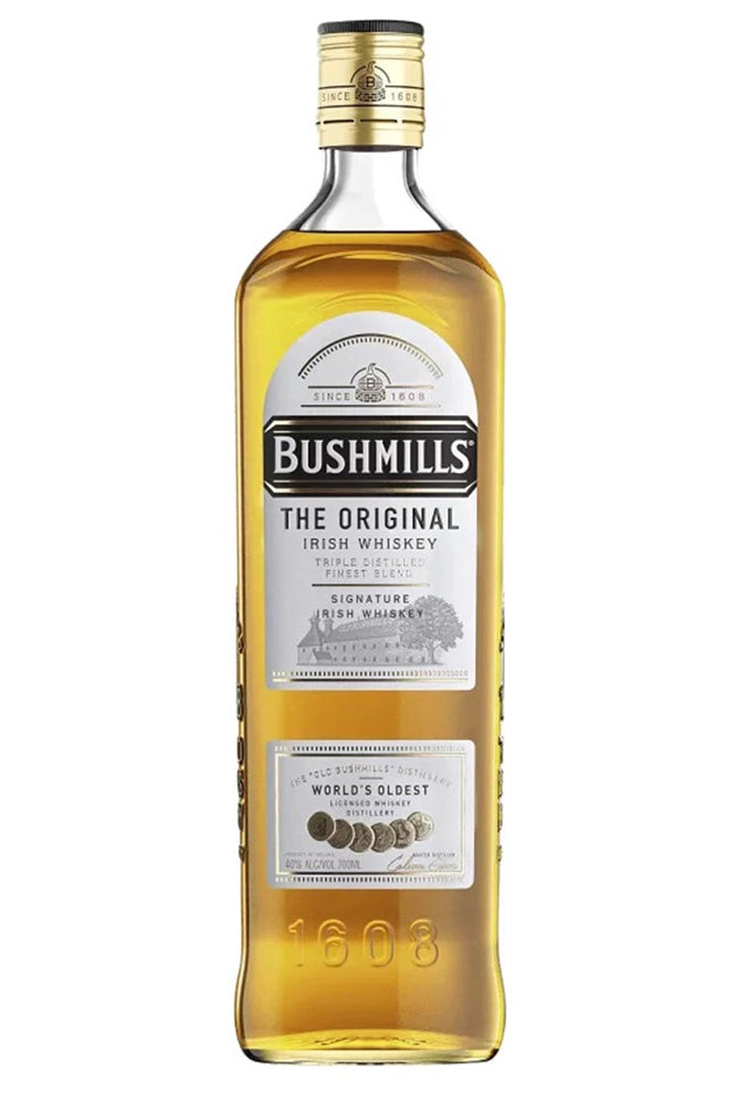Botella de whisky Bushmills Original 70 cl, irlandés triple destilado con notas de miel, vainilla y manzana verde.