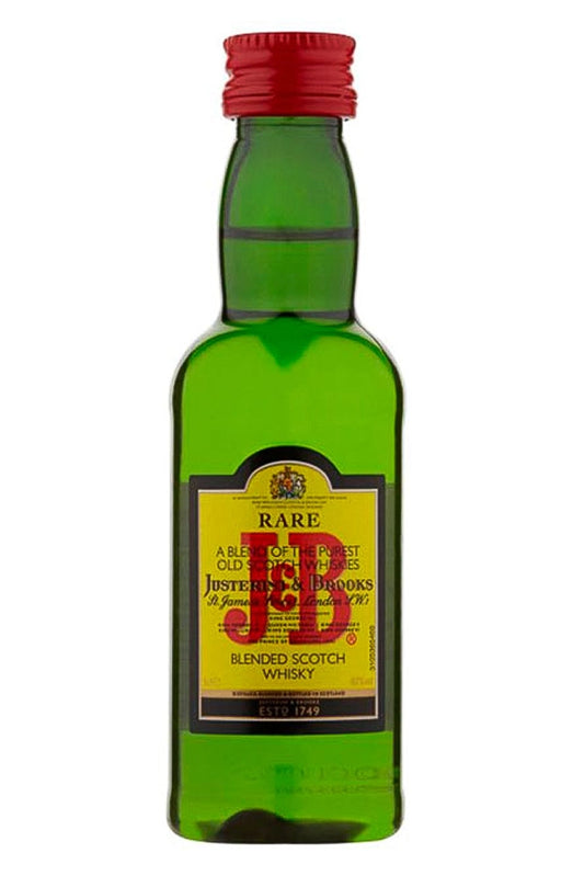 Botellín miniatura de whisky J&B Rare, de color ámbar claro, con su etiqueta amarilla característica y formato pequeño de 5 cl.