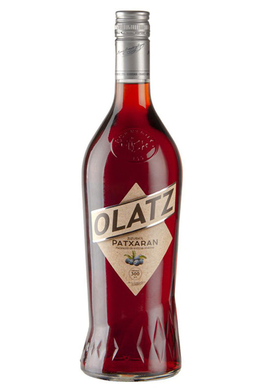 Botella de 1 L de Pacharán Olaz L, pacharán navarro artesanal con endrinas maduras y sabor intenso, ideal para sobremesas y celebraciones.